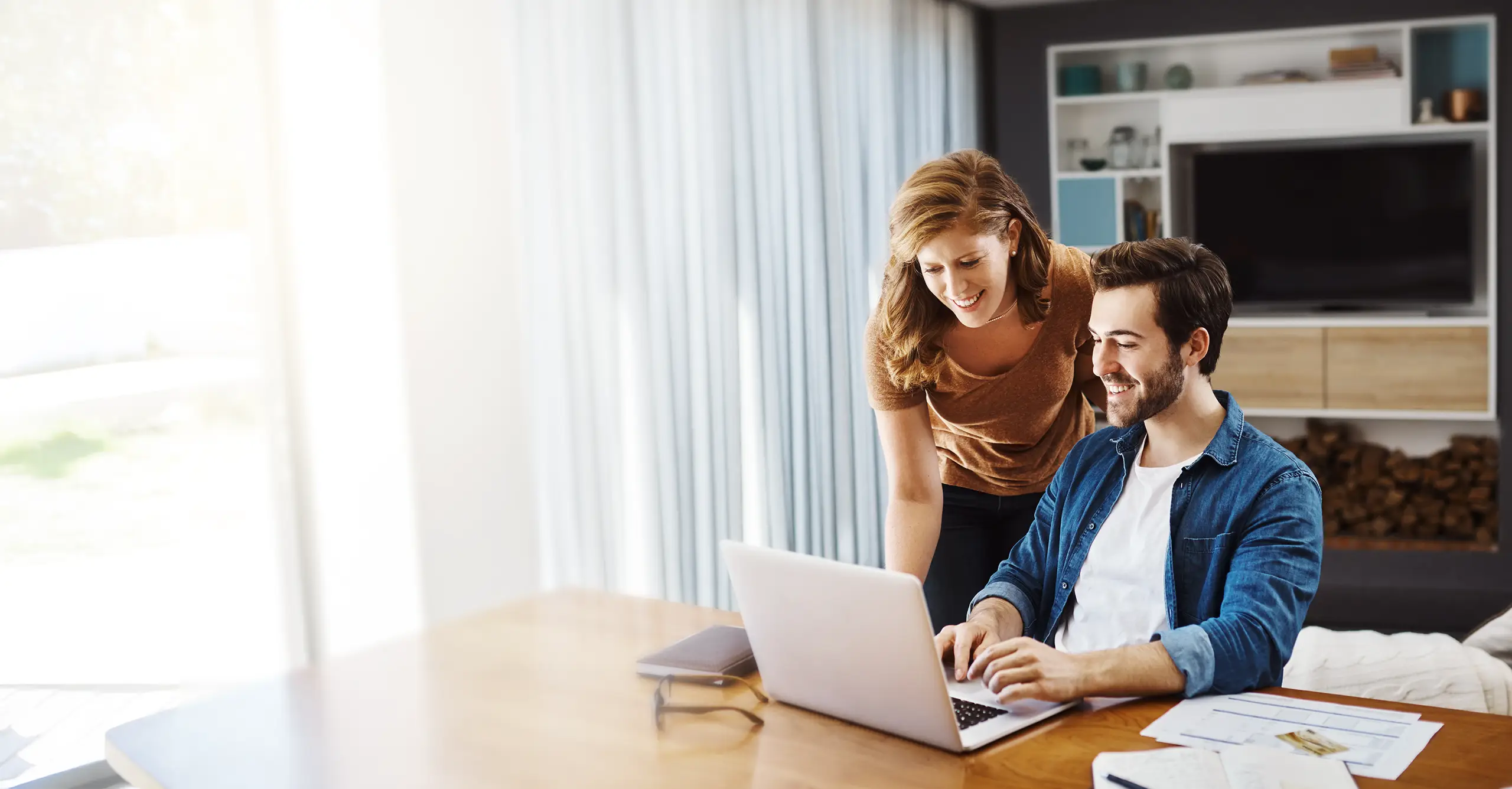 a couple using laptop to contact fertility service