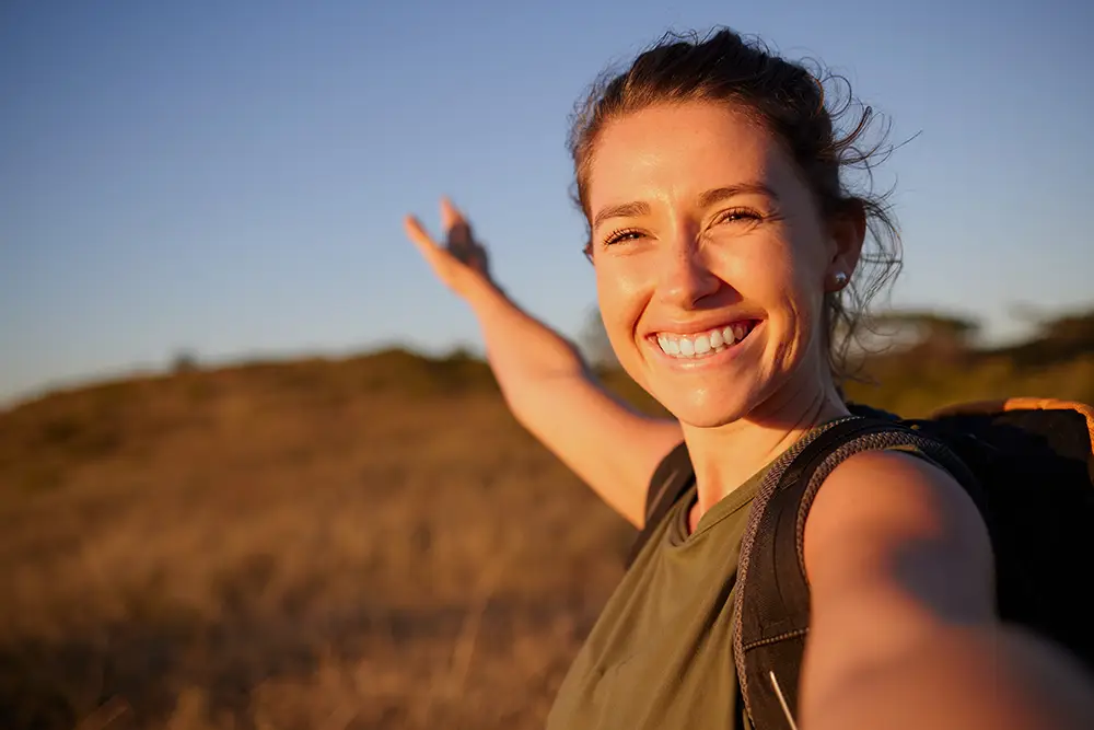 happy young woman travelling the country
