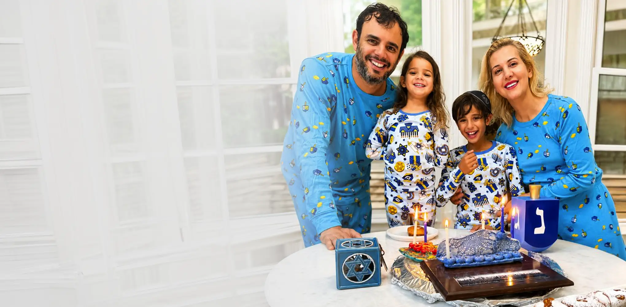 talia and yarin celebrate hanukkah with their kids